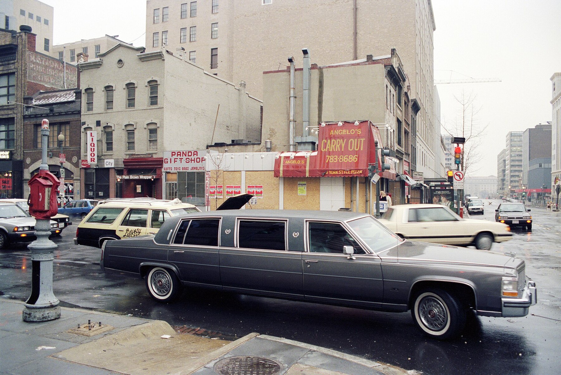 Long black limousine parked on a city street